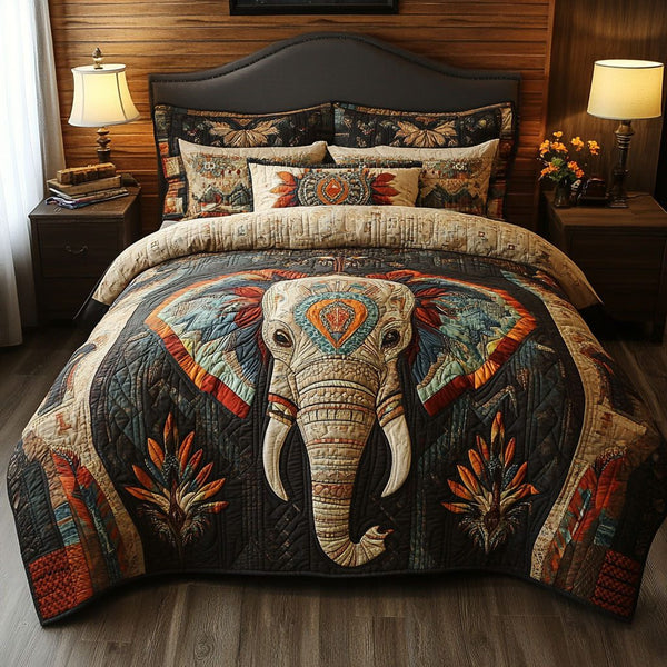 Spirit of the Elephant quilted 3-piece bedding set on a made bed with two matching pillow shams