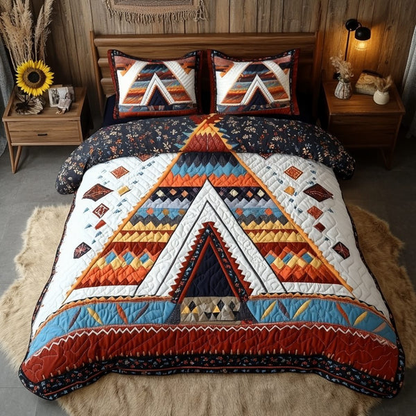 Spirit Tribe quilted 3-piece bedding set on a made bed with two matching pillow shams