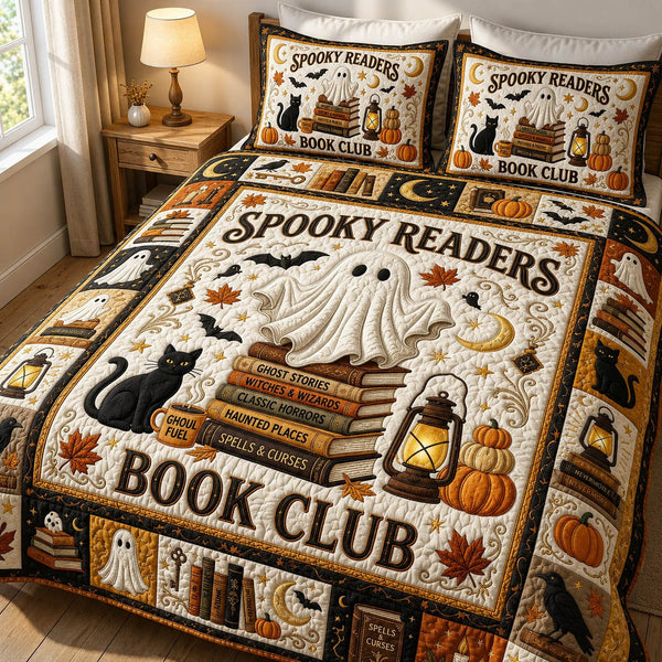 Spooky Readers quilted 3-piece bedding set on a made bed against a dark styled interior