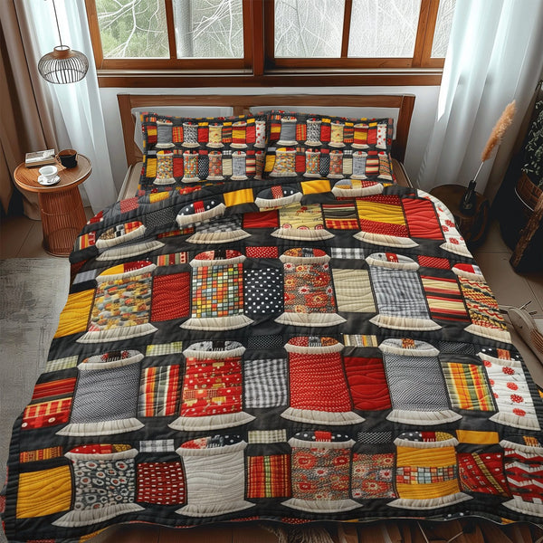 Spool Artistry quilted 3-piece bedding set on a made bed with two matching pillow shams