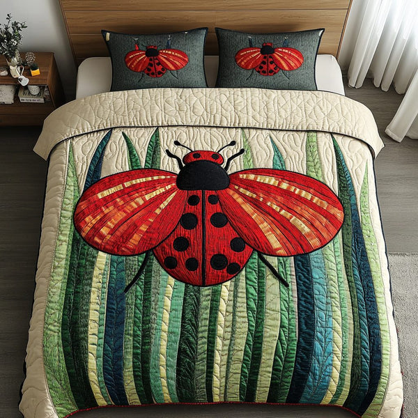 Spotted Beauty quilted 3-piece bedding set on a made bed with two matching pillow shams