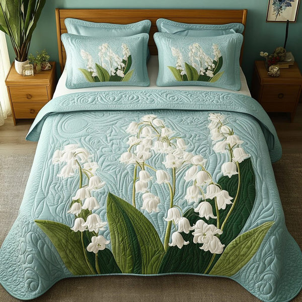 Spring Bloom quilted 3-piece bedding set on a made bed with two matching pillow shams