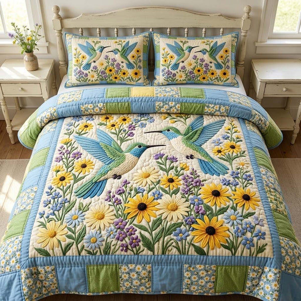 Spring Humming quilted 3-piece bedding set on a made bed with two matching pillow shams
