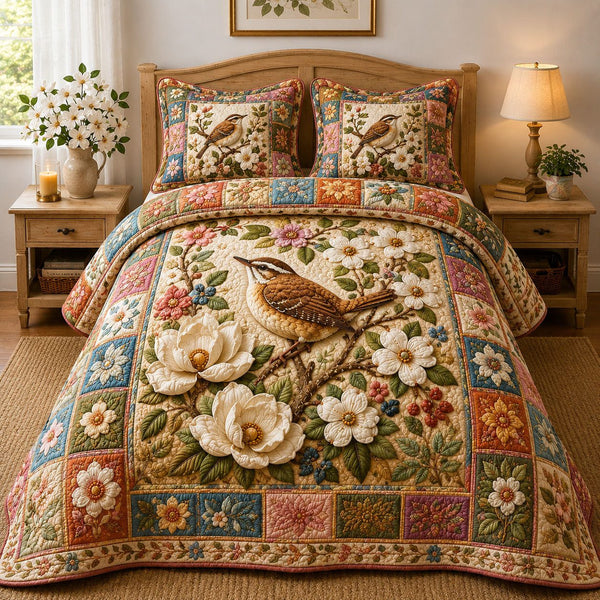 Spring Magnolia Wren quilted 3-piece bedding set on a made bed with two matching pillow shams