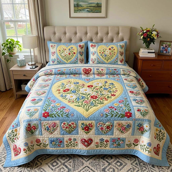 Spring Meadow quilted 3-piece bedding set on a made bed with two matching pillow shams