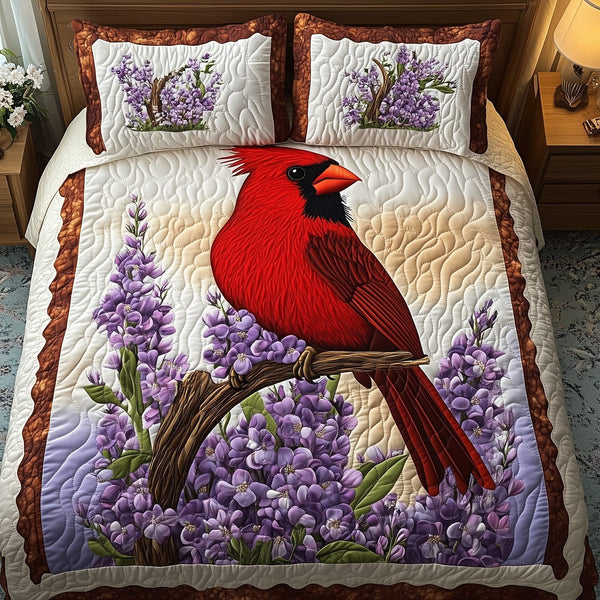 Springtime Cardinal quilted 3-piece bedding set on a made bed with two matching pillow shams