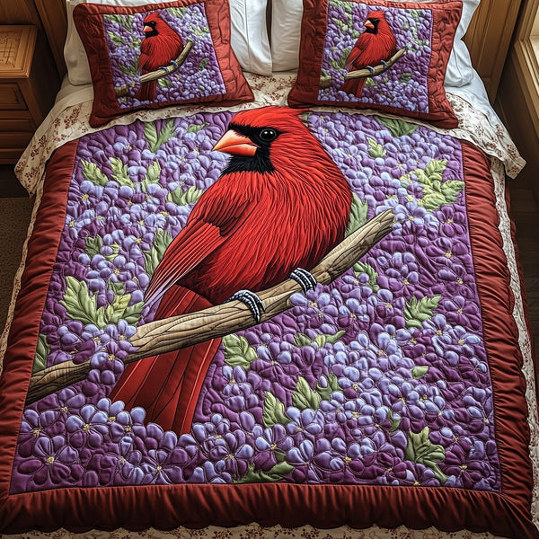 Springtime Cardinal quilted 3-piece bedding set on a made bed with two matching pillow shams