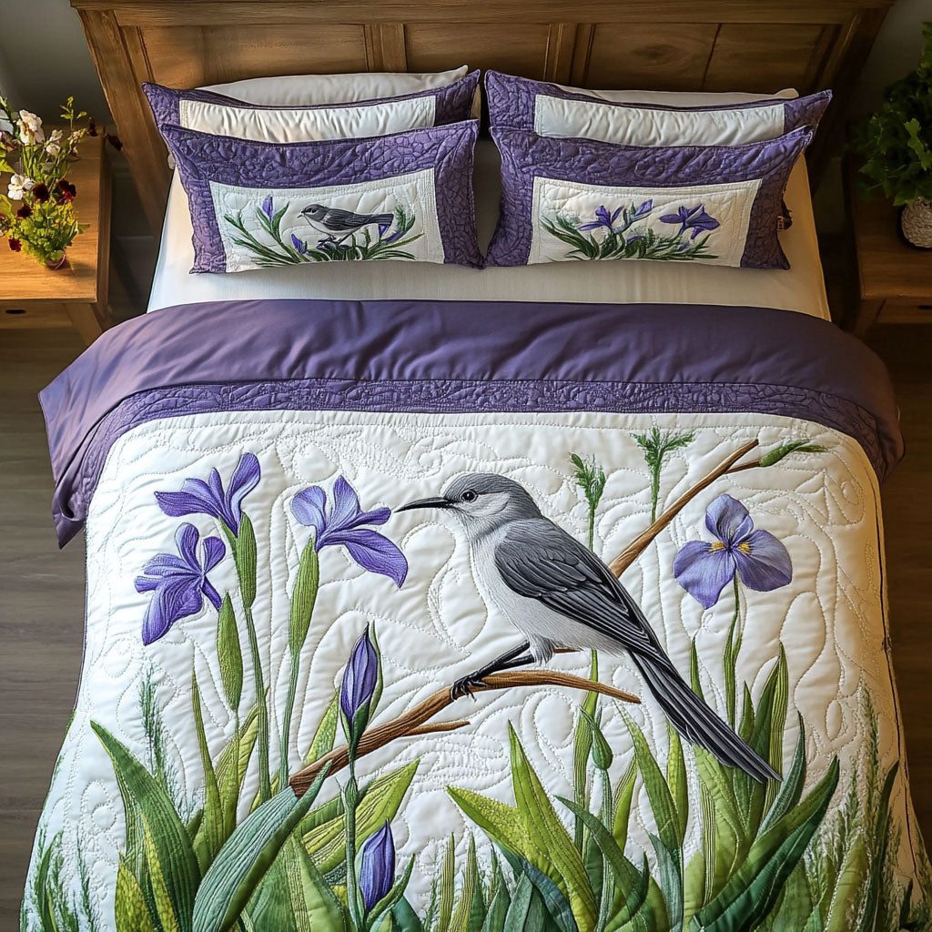 Springtime Flight quilted 3-piece bedding set on a made bed with two matching pillow shams