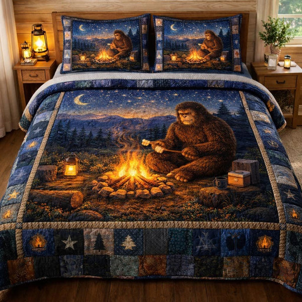 Squatch Trek quilted 3-piece bedding set on a made bed with two matching pillow shams