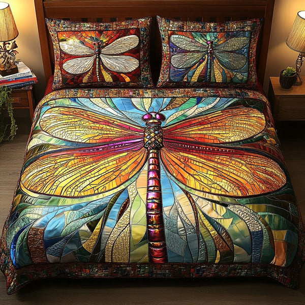Stained Glass Dragonfly quilted 3-piece bedding set on a made bed with two matching pillow shams