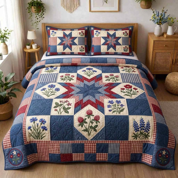 Star Meadow quilted 3-piece bedding set on a made bed with two matching pillow shams