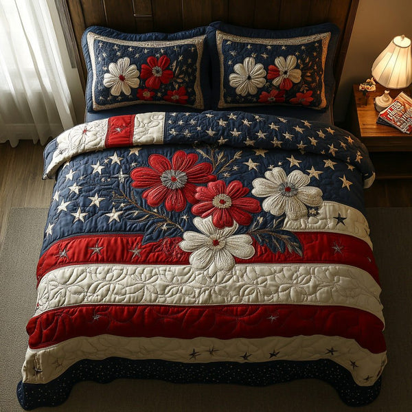 Starburst Pride quilted 3-piece bedding set on a made bed with two matching pillow shams