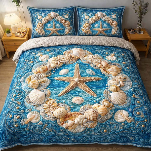 Starfish Crown quilted 3-piece bedding set on a made bed in a light coastal bedroom