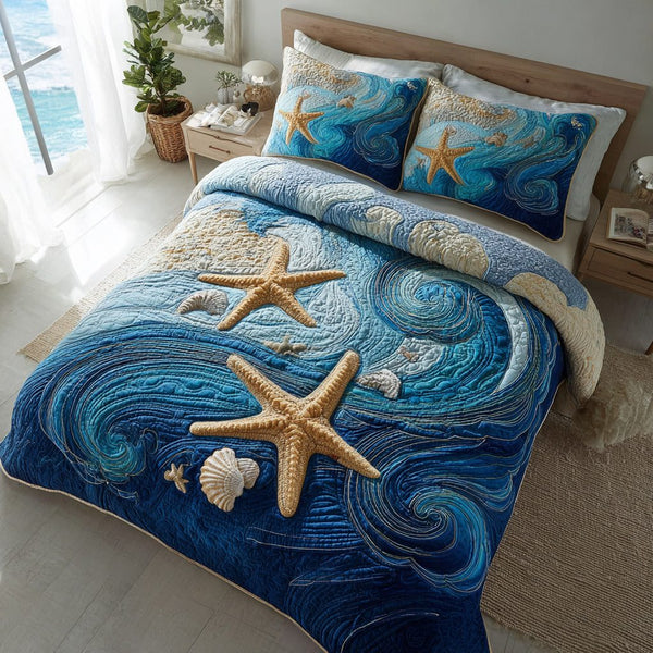 Starfish Ocean Life quilted 3-piece bedding set on a made bed in a light coastal bedroom