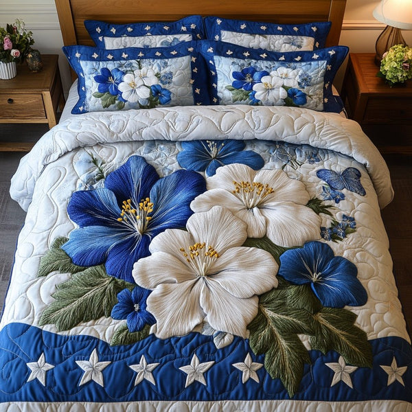Starry Bloom quilted 3-piece bedding set on a made bed with two matching pillow shams