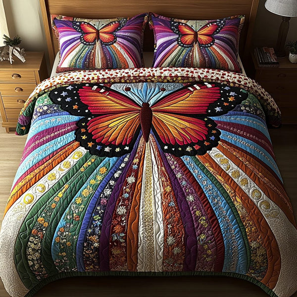 Starry Monarch quilted 3-piece bedding set on a made bed with two matching pillow shams