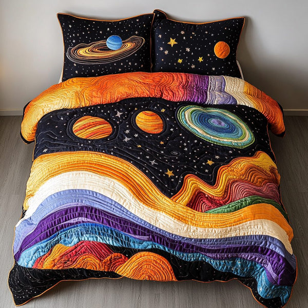 Starry Realms quilted 3-piece bedding set on a made bed with two matching pillow shams