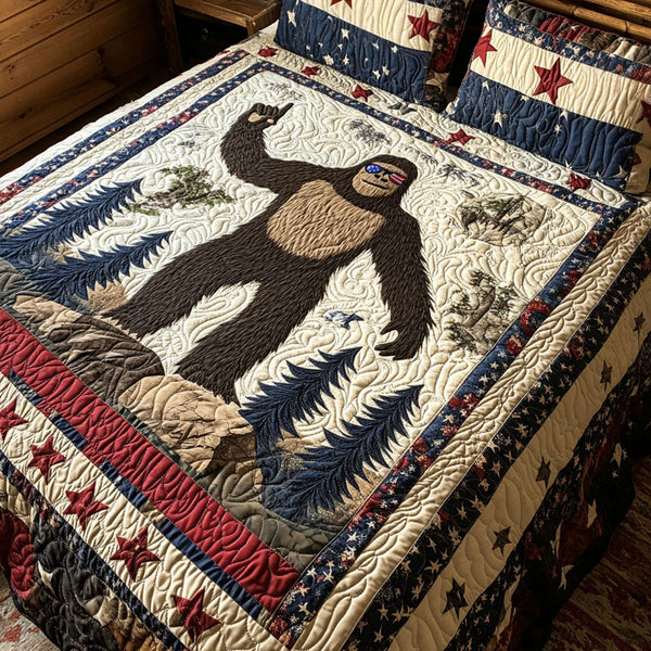 Stars and Stripes Sasquatch quilted 3-piece bedding set on a made bed with two matching pillow shams