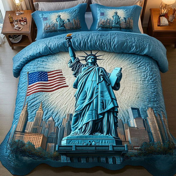 Statue Glory quilted 3-piece bedding set on a made bed with two matching pillow shams