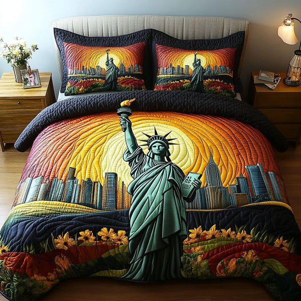 Statue of Liberty Charm quilted 3-piece bedding set on a made bed in a warmly lit bedroom