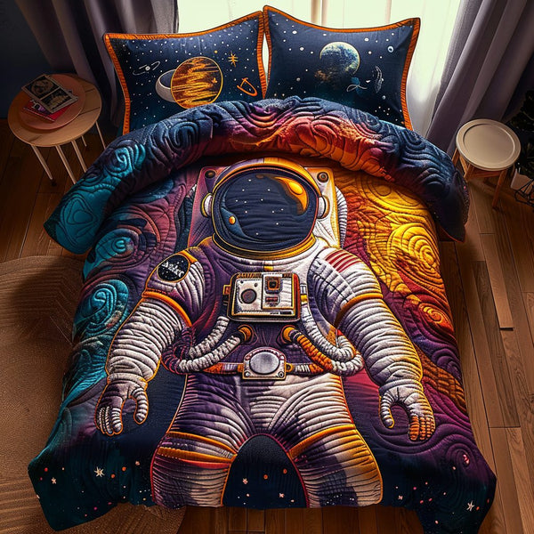 Stellar Voyager quilted 3-piece bedding set on a made bed with two matching pillow shams