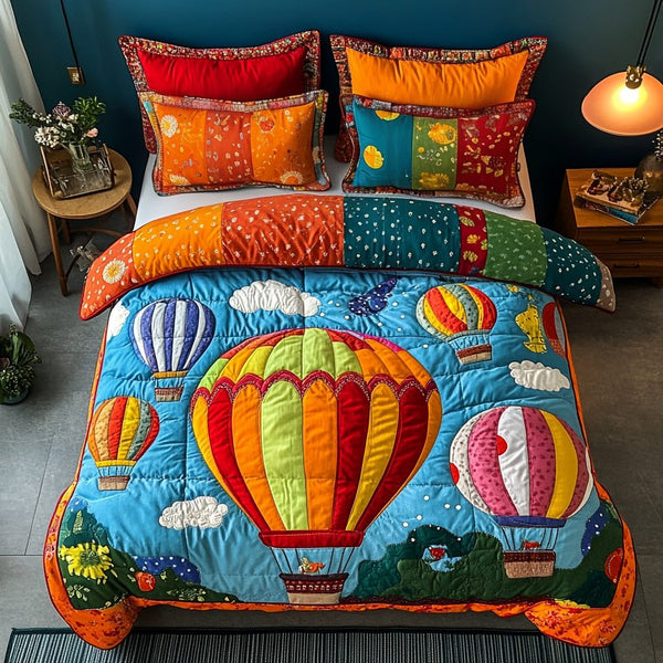 Stitched Skies quilted 3-piece bedding set on a made bed with two matching pillow shams