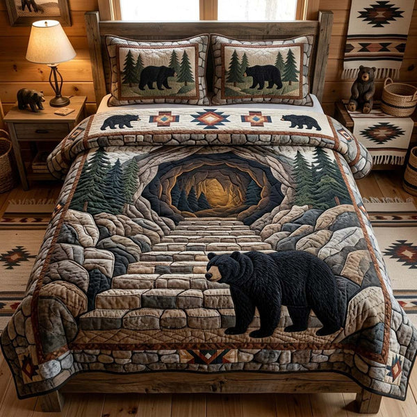 Stone Cave Bear quilted 3-piece bedding set on a made bed with two matching pillow shams