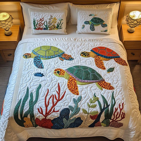 Stone Turtle quilted 3-piece bedding set on a made bed in a light coastal bedroom