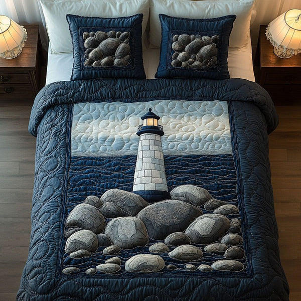 Stormy Coast quilted 3-piece bedding set on a made bed with two matching pillow shams