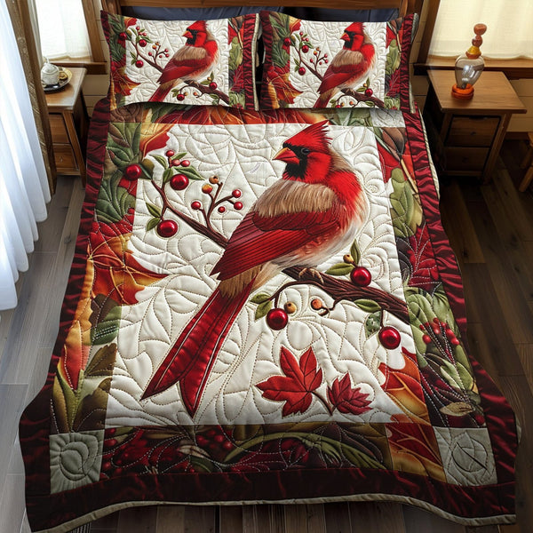 Stunning Cardinal Bird quilted 3-piece bedding set on a made bed with two matching pillow shams