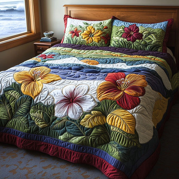 Summer Blossom quilted 3-piece bedding set on a made bed with two matching pillow shams