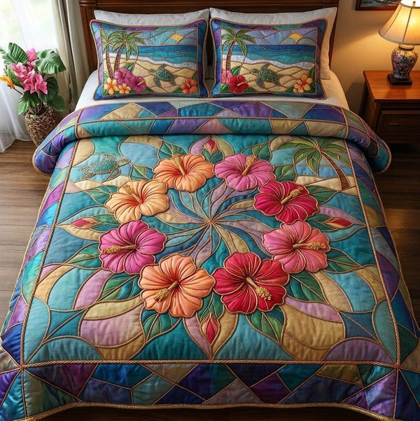 Summer Hibiscus quilted 3-piece bedding set on a made bed with two matching pillow shams