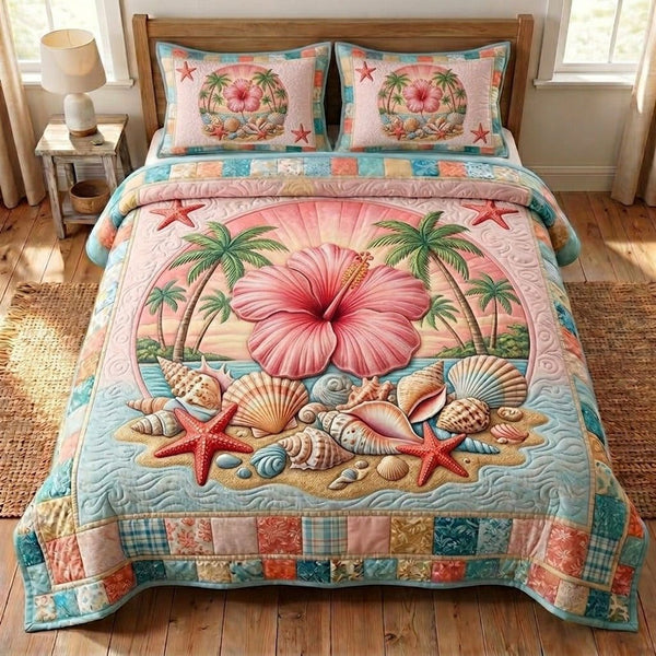 Summer Hibiscus quilted 3-piece bedding set on a made bed with two matching pillow shams