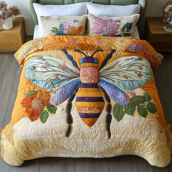 Sunburst Bee quilted 3-piece bedding set on a made bed with two matching pillow shams