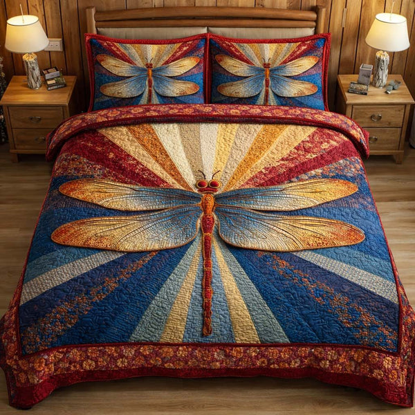 Sunburst Dragonfly quilted 3-piece bedding set on a made bed with two matching pillow shams