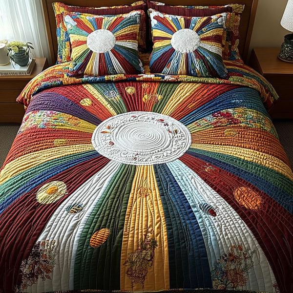 Sunburst Elegance quilted 3-piece bedding set on a made bed with two matching pillow shams