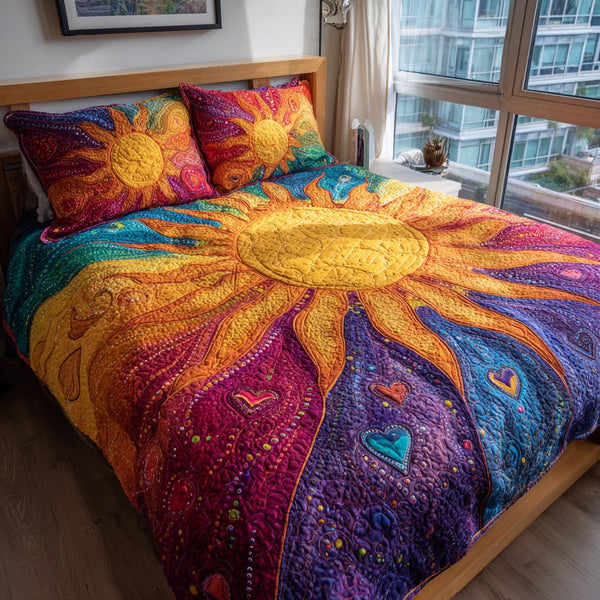 Sunburst Love quilted 3-piece bedding set on a made bed with two matching pillow shams