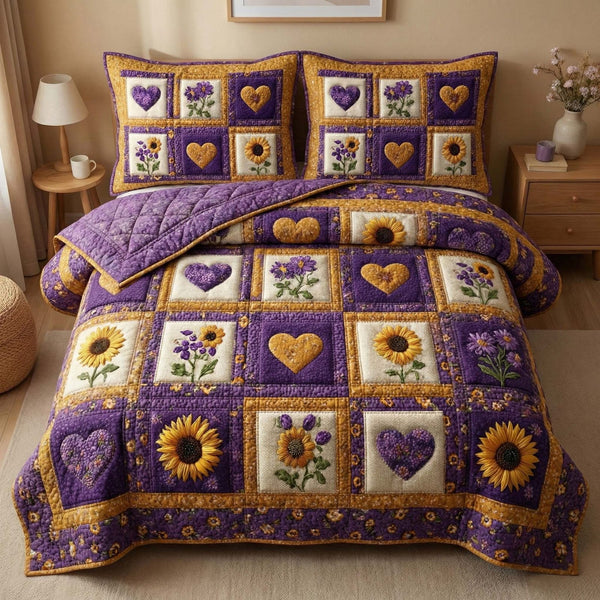 Sunflower Hearts quilted 3-piece bedding set on a made bed with two matching pillow shams