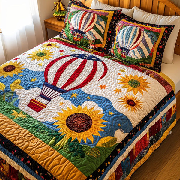 Sunflower Sky Ride quilted 3-piece bedding set on a made bed with two matching pillow shams