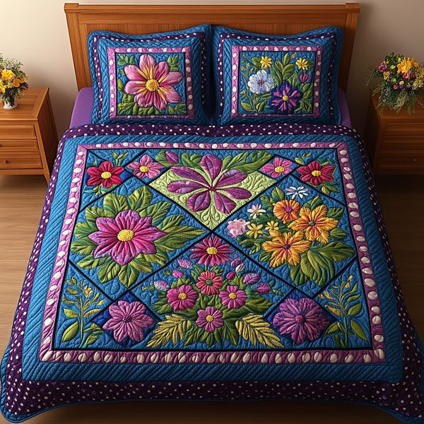 Sunlit Blossoms quilted 3-piece bedding set on a made bed with two matching pillow shams