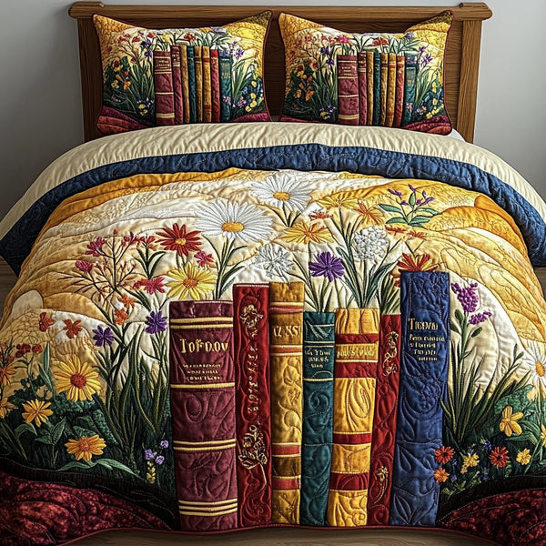 Sunlit Book Blossoms quilted 3-piece bedding set on a made bed with two matching pillow shams