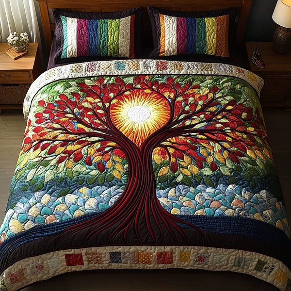 Sunlit Cascade quilted 3-piece bedding set on a made bed with two matching pillow shams