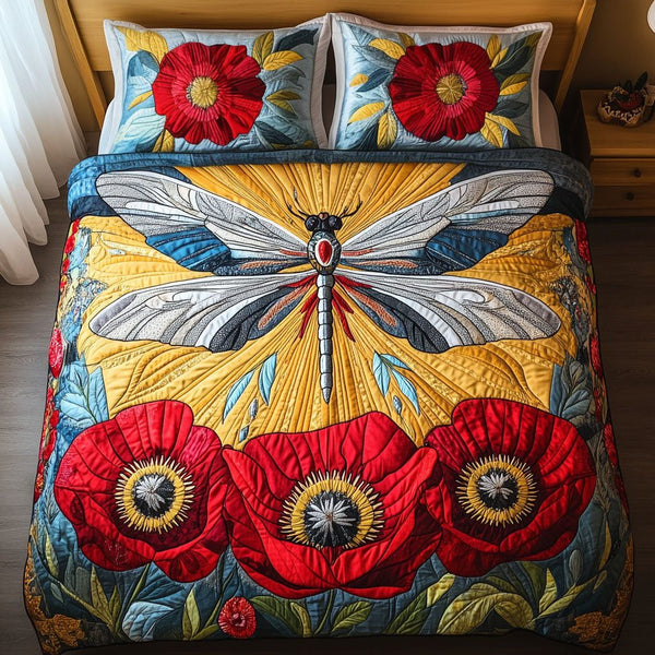 Sunlit Dragonfly Haven quilted 3-piece bedding set on a made bed with two matching pillow shams
