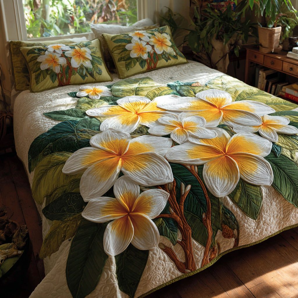 Sunlit Plumeria quilted 3-piece bedding set on a made bed with two matching pillow shams
