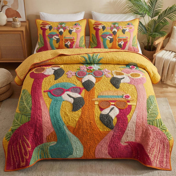 Sunny Flamingos quilted 3-piece bedding set on a made bed with two matching pillow shams