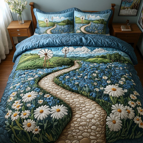 Sunny Pathway quilted 3-piece bedding set on a made bed with two matching pillow shams
