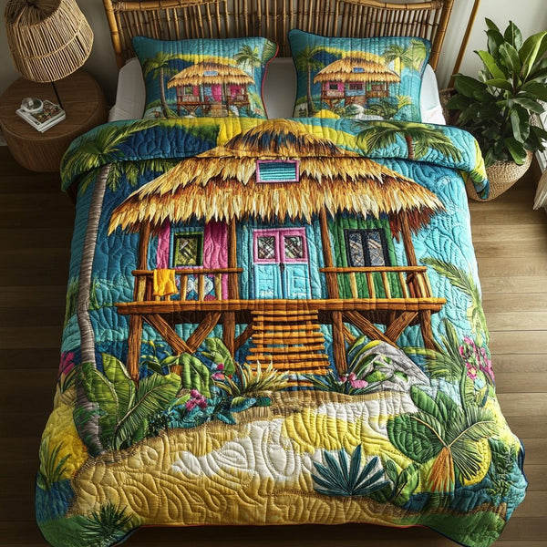 Sunny Shores quilted 3-piece bedding set on a made bed in a light coastal bedroom
