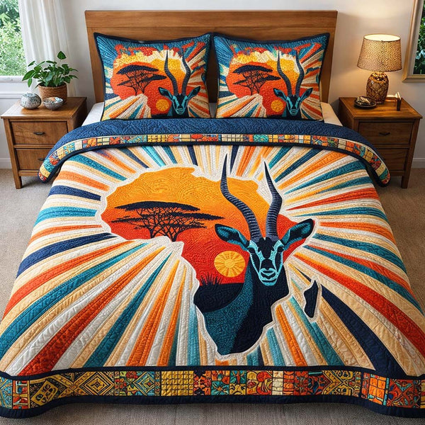 Sunrise Antelope Power quilted 3-piece bedding set on a made bed with two matching pillow shams