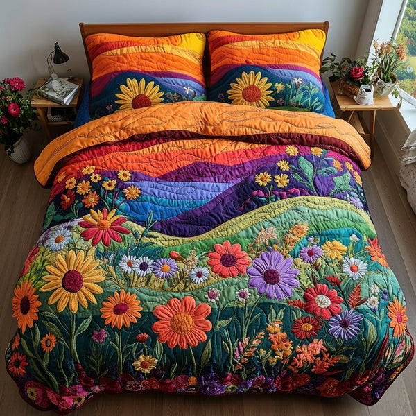 Sunrise Blooms quilted 3-piece bedding set on a made bed with two matching pillow shams