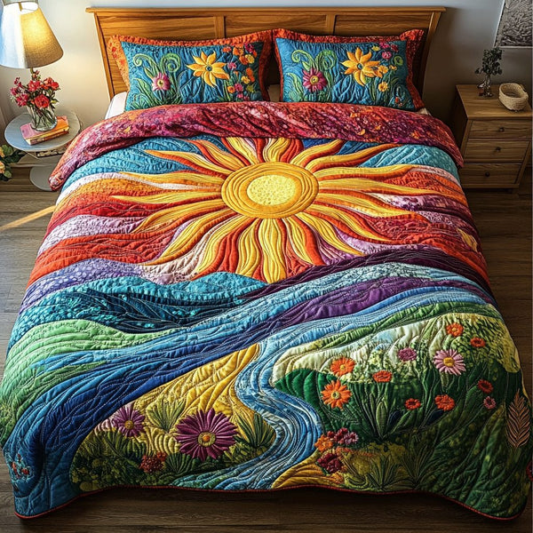 Sunrise Comfort quilted 3-piece bedding set on a made bed with two matching pillow shams